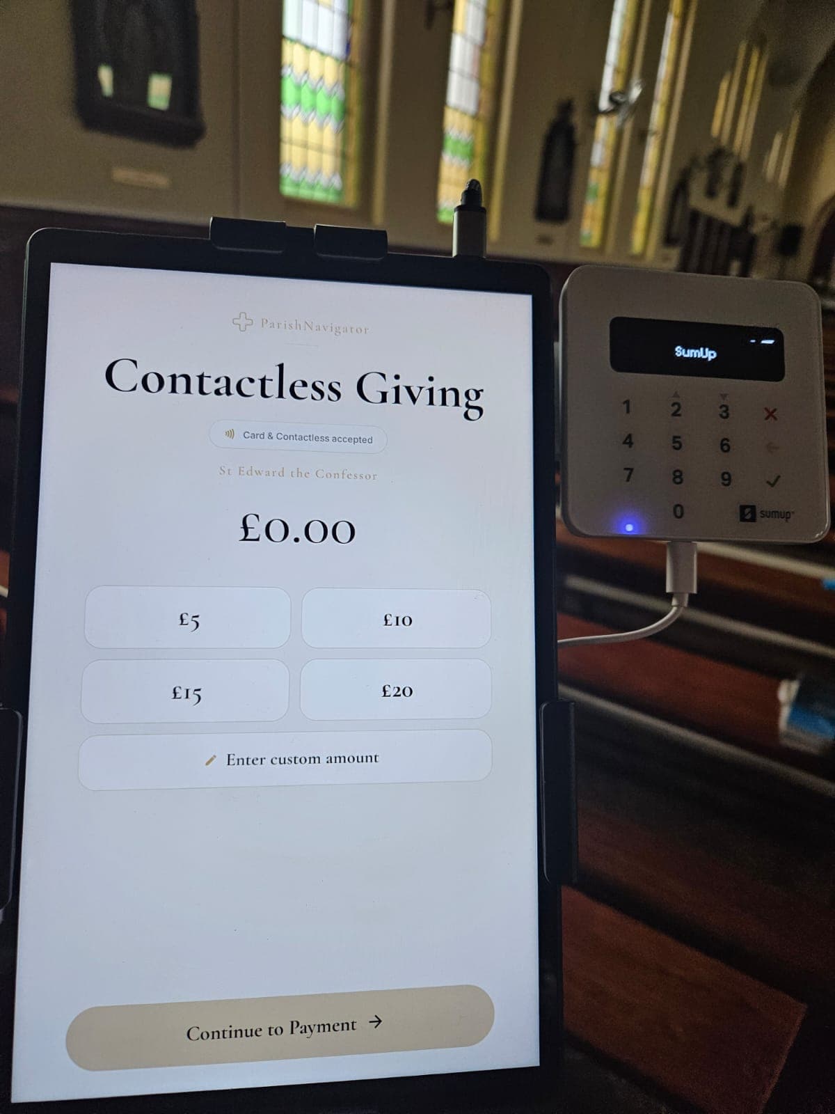 ParishNavigator contactless donation stand displayed inside a church
